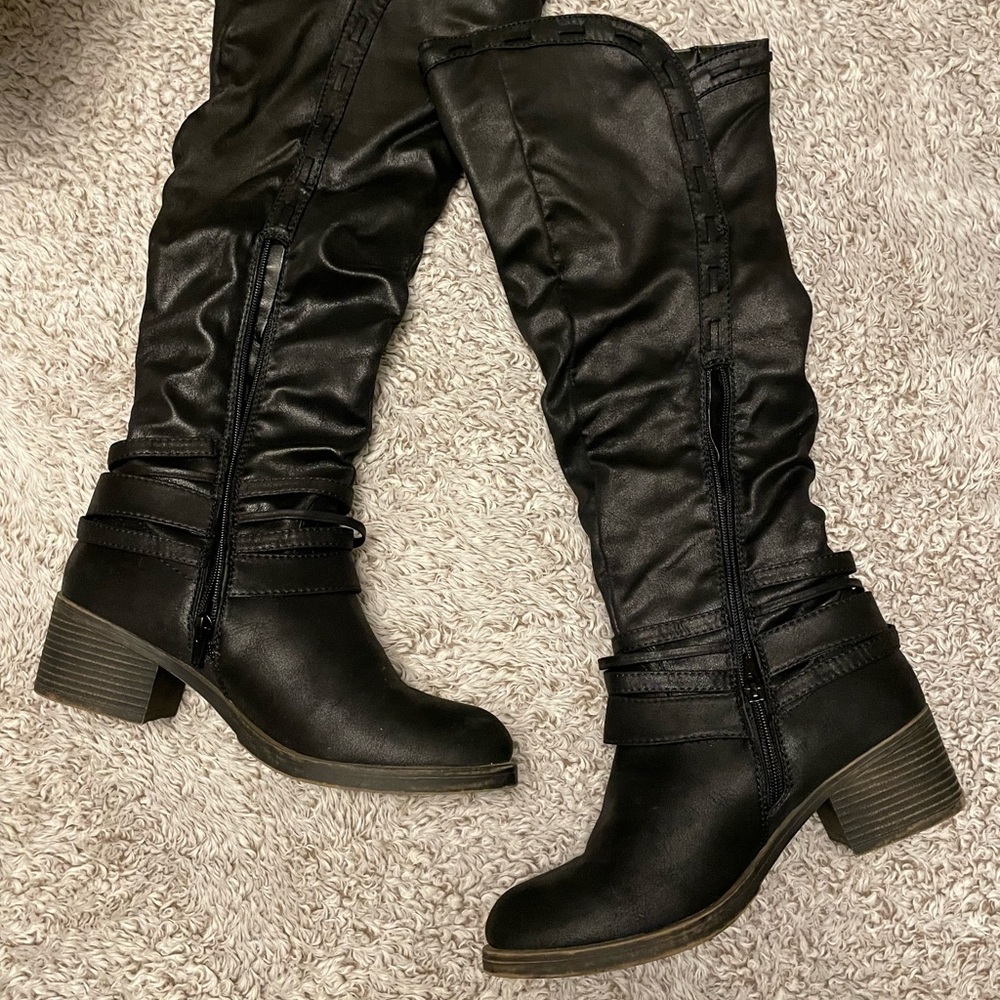 Maurice’s black knee high boots.
